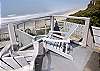 Wooden chairs overlooking your own Private Hot Tub and Oceanfront.