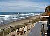 Relax in a lounge chair overlooking the ocean, sand and surf!