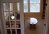 Privacy Blinds and queen hideabed make this a perfect 3rd bedroom complete with hooks, dresser, TV &amp; DVD
