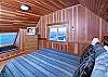 One of 2 living rooms. Large Plasma TV. Large Picture Windows overlooking the Surf!