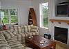 Huge grand room with picture windows overlooking the sand and surf! 180 degree views! Gas fireplace and cable TV / DVD