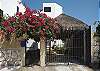 Casa Ricardo street entrance with garage parking area.