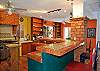 Casa Mulder large kitchen with large fridge and stove, dishwasher.