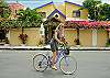 Front of Abbey One with guest riding one of our free bikes