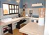 Juanita #3 kitchen with large stove and fridge.  Lots of counter space.