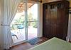 Abbey Two #11 bedroom closet and patio door to balcony with breeze