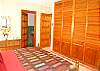 Abbey One #4 master bedroom closet with TV and DVD, private bath
