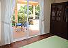 Abbey Two #10 bedroom opens onto large patio with shade and sun