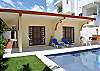 Casa Anita entrance from the street in the background. Llarge french doors to let in light and breeze