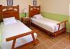 Second bedroom with two twin beds that can be pushed together to be a king.