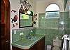 1st floor bath with door opening to pool area.