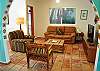 Open and airy TV/living room with flat screen tV.