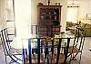 Formal dining room with patio doors out onto a lovely garden terrace with a table and 4 chairs; perfect for your morning coffee and breakfast.