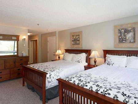 Master Bedroom with two queen beds and queen pull out sofa