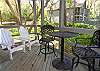 Screened porch with tennis views.