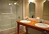 Private bathroom for Bedroom 3 with two sinks and shower