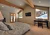 Master Bedroom with California King, television, washer/dryer, and private deck