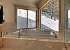 Infinity Jetted Tub with forest view