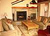 Living room with comfy couches and a warm gas fireplace
