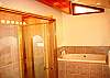 Master Bathroom with a high bathtub and shower