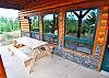 Lower level patio with picnic table.