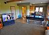 Big Screen TV with DVD, DirecTV and movie library!  Air Hockey, Foosball and Wet Bar to the right.