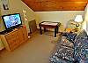 Loft Area with game table, large Flatscreen/Cable and pull out couch.