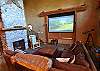 Great room with a large sectional couch, floor to ceiling river rock fireplace and a large projection screen TV w/Sattellite, DVD and surround sound!