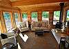 Very comfortable main floor sunroom.  The gas stove keeps this room warm and inviting during the Winter!  Great spot to curl up with a good book.