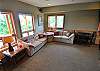 Large, lower floor entertainment room with large sectional couch with a Queen Hide-a-Bed.  Kid's table with 4 chairs.