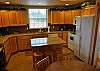 Kitchen and one of two dining tables.  Total Seating for 10, plus 3 bar stools.