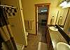 Master Bathroom with Double Sinks and Tile Shower.