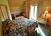 Upper Floor Master with a King Bed, Twin Bed and a Twin Trundle.  Sliding doors lead to private balcony.  Door to the left leads to a private bathroom.