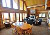Fantastic Great Room with soaring ceilings and a wall of windows to take in the fantastic views!  Dining Table expands to sit 12.