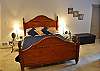 King Bed in one of the Master Suites