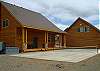 Pickleball Court to the side of the cabin and behind the garage.  Hot Tub at the end of the deck.