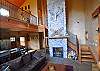 25ft soaring pine ceilings in the great room with a 10ft projection screen!  Perfect for entertaining!