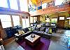Large great room with double doors leading to the oversized deck!
