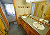 Double sinks and two shower stalls.
