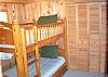Twin bunkbeds are just off the family room with an accordian door for privacy.
