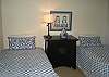 New Twin beds with down comforters in the cozy bedroom.