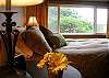 Comfortable pillow-top Queen bed with tasteful decor and calming colors provide a restful atmosphere for a good night's sleep.