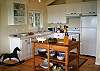 Brand new kitchen includes all new appliances, cookware, dishware.  Fridge/freezer w/ice-maker, dishwasher, marble countertops, lot's of cupboard space too.