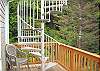 Sturdy stainless steel spiral staircase leads to the roof top deck from the "ocean room" living room level.