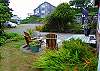 Relax in the comfortable Adirondack chairs off the west porch deck as you take in the ocean breezes only a block away.