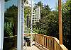 This deck off the living room leads the spiral steps that will take you to the roof-top deck, with panoramic ocean views and comfortable seating to take it all in.