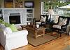 Cozy wood burning fireplace, 32" flat panel TV w/DVD, satelite stations, I-pod dock w/CD player as well for your entertainments needs.  All new hardwood pine floors w/grass mats.