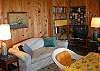 This living room sofa folds out into a Double hideabed.  A featherbed to place under the mattress pad is provided for comfortable sleeping.  Extra linens,
bedding and pillows are provided as well.