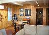 Another living room view including the game table, CD stereo system, and glimpse of Master bedroom entry door.