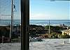 Only a block & 1/2 walk to an easy beach access, you can see the white water views of the ocean from upstairs windows in Family room as well as Main floor living & dining room.